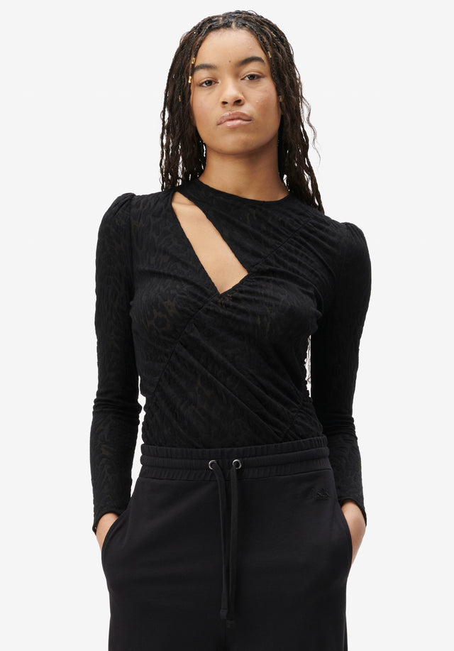 Top Tera black leo - Sleek and sexy, this stretchy jersey top features a cut-out...
