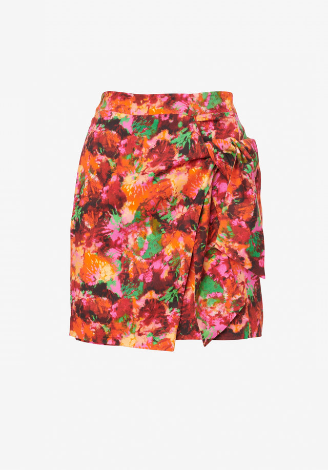 Skirt Solea shibori flower - Shibori florals with lush pops of green are displayed on...
