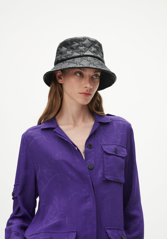 Bucket Hat Honi mono black - Honi is a stylish bucket hat with an artfully quilted...
